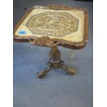 An early 20th century occasional table converted from a pole screen