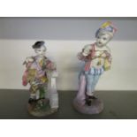 Two late 19th century German porcelain figurines, one of a young male holding a box, marks to