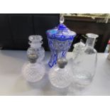 Two cut glass and silver topped dressing table bottles, a blue overlaid and cut glass vase and