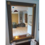 A reproduction wall hanging mirror