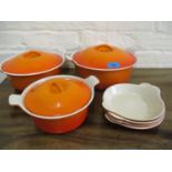 Three French Le Cruset burnt orange casserole dishes with lids A/F and four matching shallow dishes
