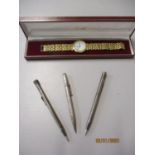 Three mid 20th century propelling pencils to include a silver cased pencil, together with a