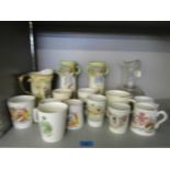 A pair of Doulton series ware vases, various commemorative mugs and a cut glass wine jug A/F