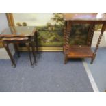 An early 20th century oak two tier occasional table with barley twist supports, together with a nest