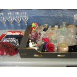 A selection of miscellaneous empty perfume bottles and glassware, along with cosmetic bags