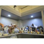 A mixed lot of ceramic and resin horses and other animal ornaments, along with a collection of