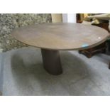 A modern contemporary oval topped dining table on a single oval pedestal 29 1/4"h x 67"w.