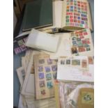 A quantity of 20th century worldwide stamps to include Chinese stamps, two albums, a stock book