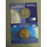 A silver 2004 £2 Britannia one-ounce coin, and a silver £2 Britannia 2001 one-ounce coin in original