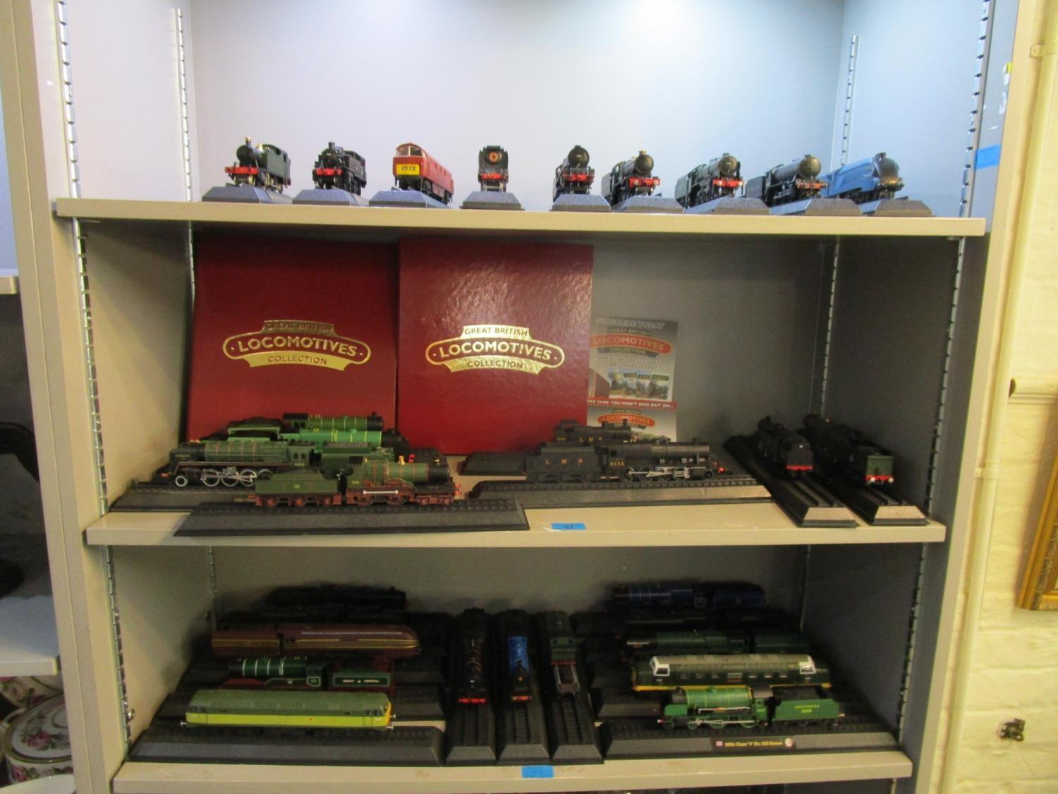 A collection of thirty Americon 00 gauge model locomotives with two folders of magazine information