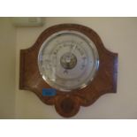 An early 20th century oak Android Barometer