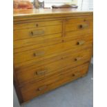 A late Victorian/early Edwardian oak chest of two short and three long drawers