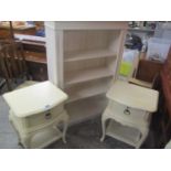 A modern cream open front bookcase, together with a pair of two tier French style lamp tables