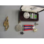 A war medal 1939-1945 together with a Battle of Britain commemorative medal enamel pins and a