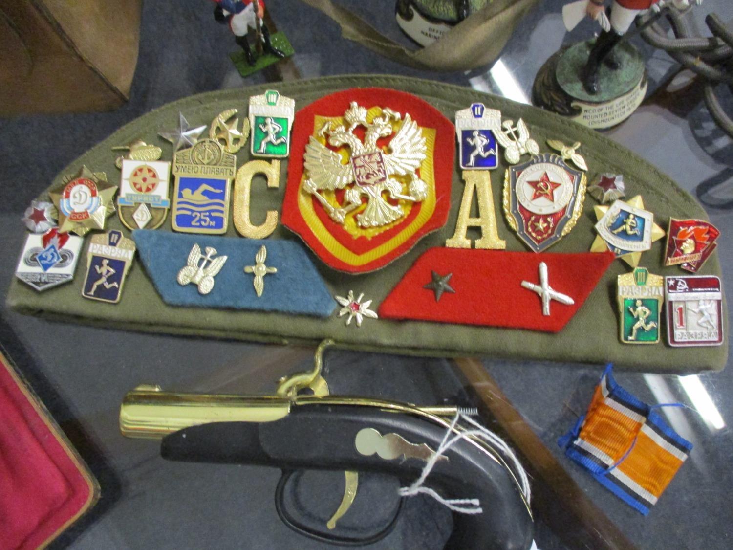 Military related items to include two gas masks, modern painted lead figures of soldiers, and a - Image 2 of 4