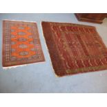 A Middle Eastern red ground rug 53" x 65", together with a smaller terracotta ground rug with