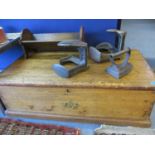 A small pine chest with later brass side handles, together with irons and an oak book rack