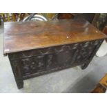 Circa 1650 a large oak coffer having a carved panelled front and block shaped feet, 31 1/2"h x 54