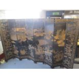 An eight-fold Oriental chinoiserie screen depicting battle scenes with water to the foreground and