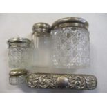 Four mixed cut glass and silver topped dressing tables jars together with a silver topped brush