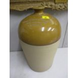 A large Whitton & Ashley Wine Merchants of Lincoln stoneware flagon, 19 1/2"h