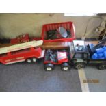 A Tonka pick up truck, a Tonka buggy, a fire engine, toy soldiers, cars and fire truck
