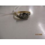 An 18ct gold and platinum diamond ring Location: CAB