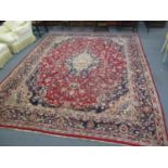 An early 20th century hand woven Persian carpet made in Mashhad Iran 3.7m x 2.9m