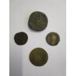 A group of four Roman coins to include a mid 18th century 1 Soldo (12 Bagattini) coin, a Roman