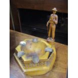 Trench art - a carved wood ash tray with brass sections, surmounted by a figure carved Caen 1994