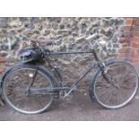 A vintage Raleigh racing bicycle with a Brooks leather seat A/F, rear satchel, in black, circa 1930