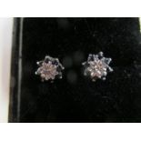 A pair of 9ct gold diamond and sapphire ear studs