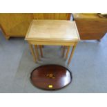A walnut nest of three tables with inset glass top, and an Edwardian mahogany inlaid oval gallery