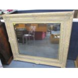 A modern large wall hanging mirror having scroll and shell shaped frame 47"h x 53"w