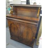 A 19th century rosewood chiffonier having a raised back, cushion moulded drawer and two cupboard