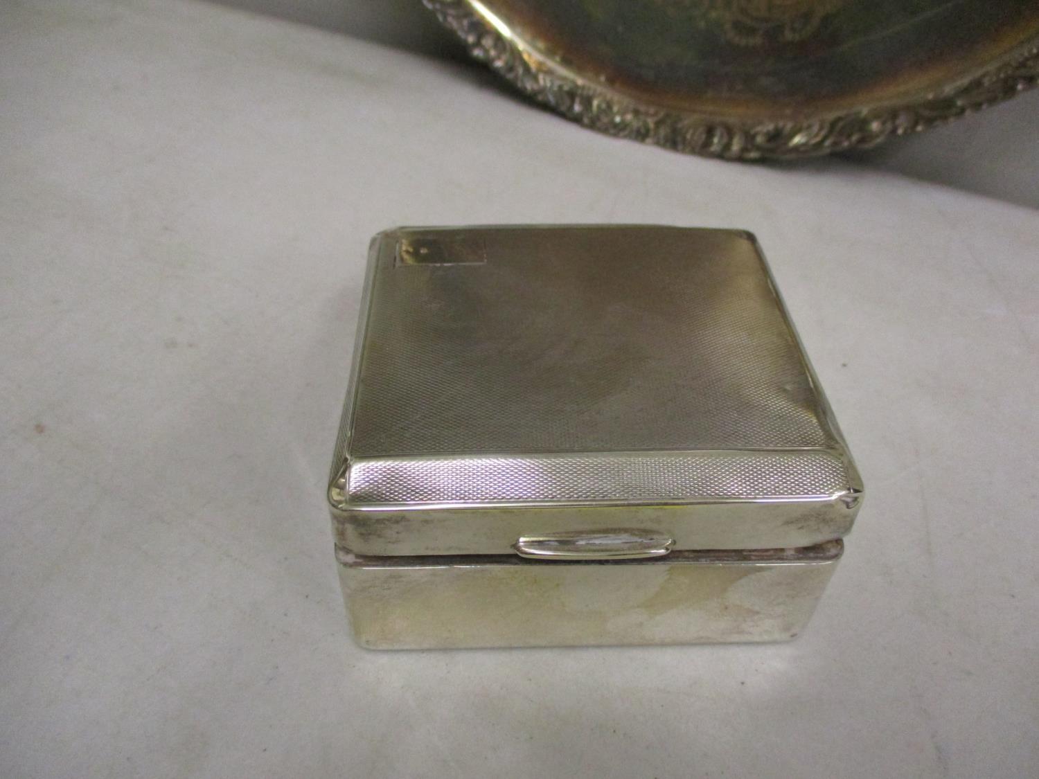 A silver cigarette box 3 1/2" x 3 1/2", total weight 247.75g, together with a silver plated and - Image 4 of 4