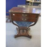 A Victorian mahogany sewing table having two inset drawers and quatrefoil base, 30 1/4"h x 23 1/2"w,