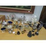 A quantity of silver plate to include a teapot, coffee pot, trophy cups and other items, along