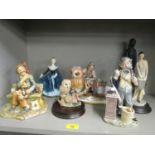 A miscellaneous group of figurines to include a Doulton lady figurine