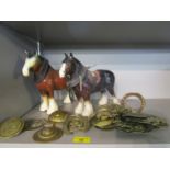 A group of brass horse brasses and two ceramic models of Shire horses