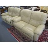 A pair of modern leather La-Z-Boy two seater reclining sofas