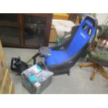 A Corbeau Gameracer Elite gaming chair and boxed Logitech Driving Force GT Steering wheel and pedals