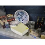 A vintage lot comprising metalware, a pair of brass candlesticks, Seca bathroom scales, a pair of