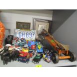 A mixed lot to include a trolley jack, pictures, elephant ornaments, Robertson Golly figures, and