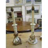 A pair of late Victorian porcelain candlesticks with floral sprig decoration, later converted to