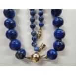 A lapis lazuli beaded necklace with 9ct gold ball clasp, and one other. Location:Cab