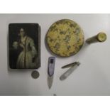 A 19th century Georgian papiermache snuff box decorated with a lady to the lid, a mother of pearl