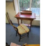 An Edwardian satinwood inlaid mahogany desk with a hinged lid, red scriber and a long drawer and a