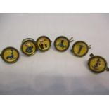 A cased set of Guinness waistcoat buttons