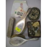 A set of three silver backed dressing table set items with engine turned decoration, RAF buttons,